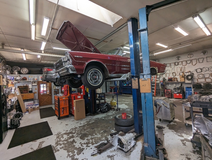 Classic Ford Galaxie on the lift with its transmission removed