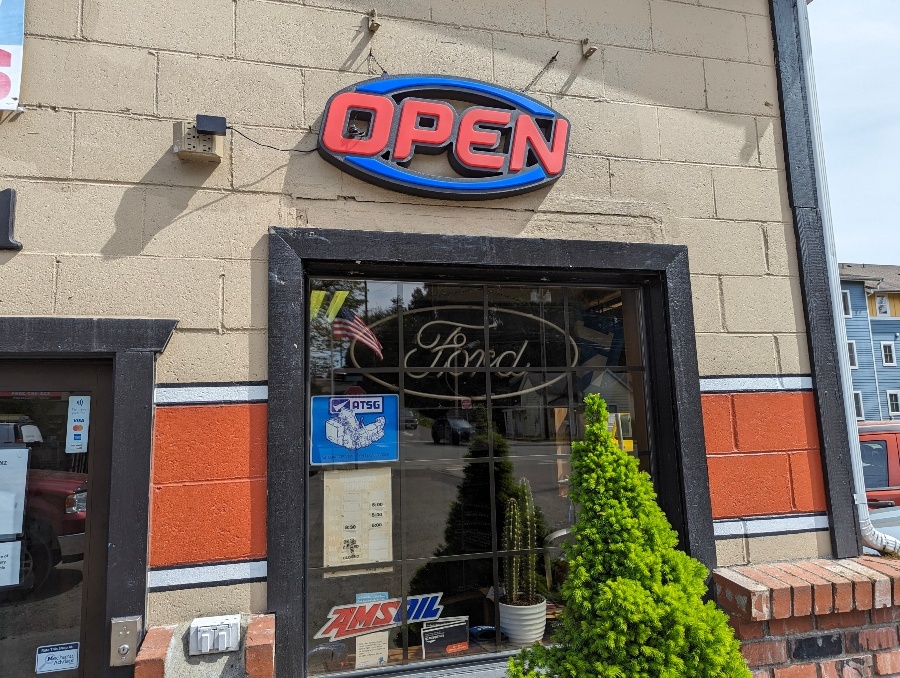 Open sign over the front window at Jamie's Transmission Service
