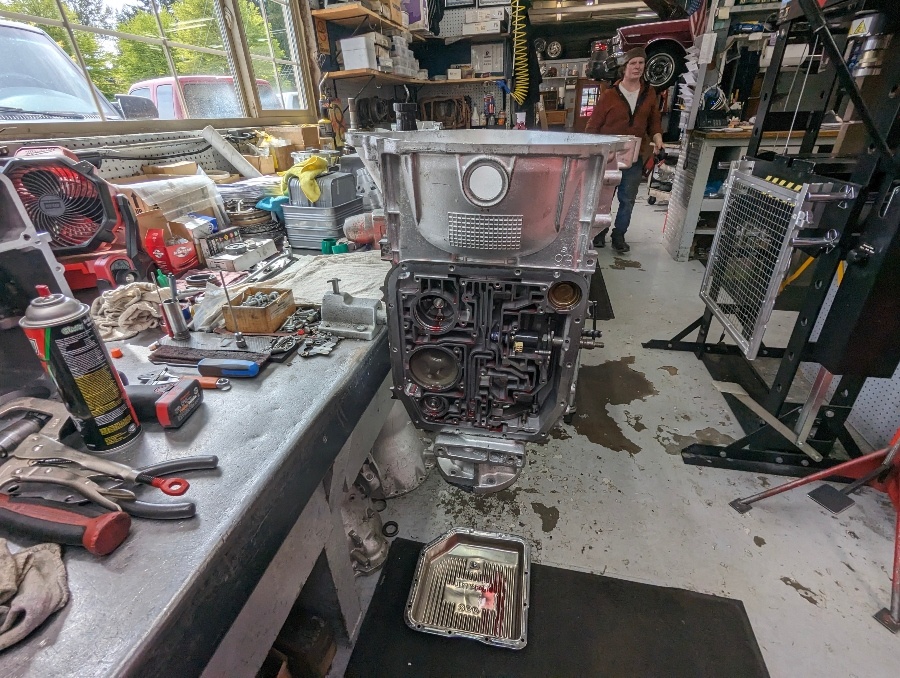 A rebuilt transmission with its valve body exposed in the rebuild room